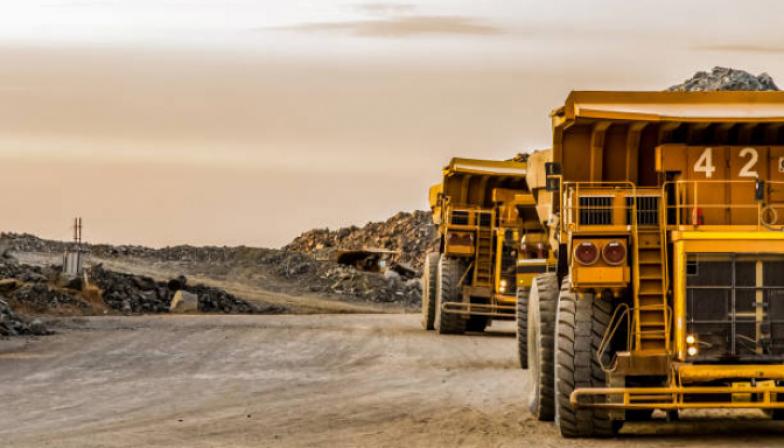 Trucks transporting platinum ore for processing